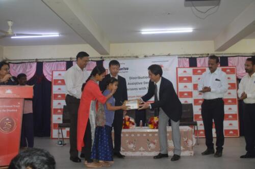 Mr. Kengo Ogawa from Komatsu India Private Limited distributed assistive devices to people with disabilities-5